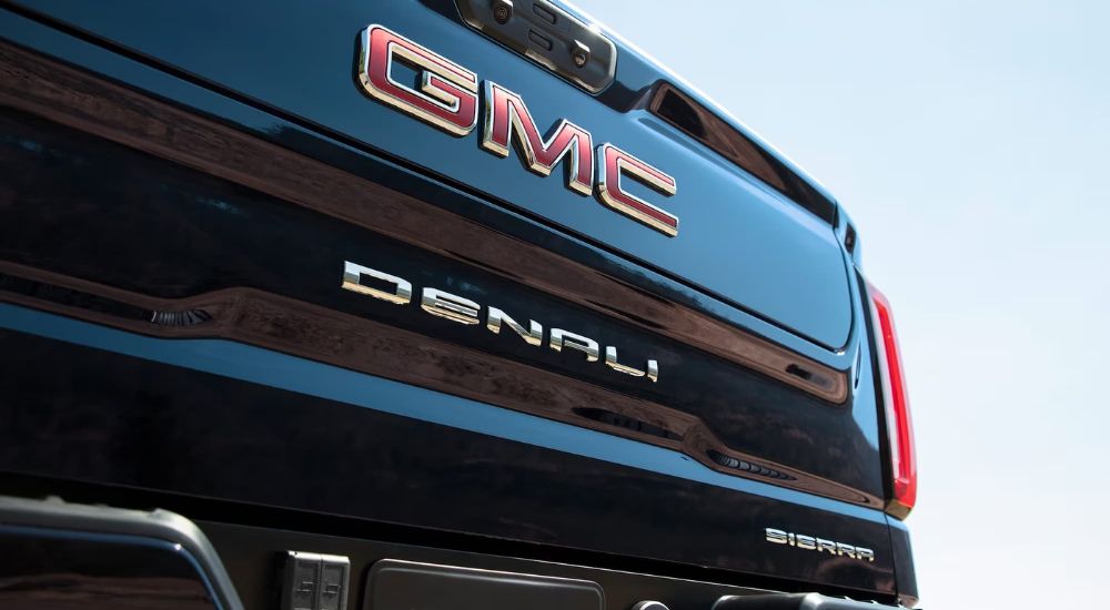 The tailgate on a black 2024 GMC Sierra 1500 Denali is shown.