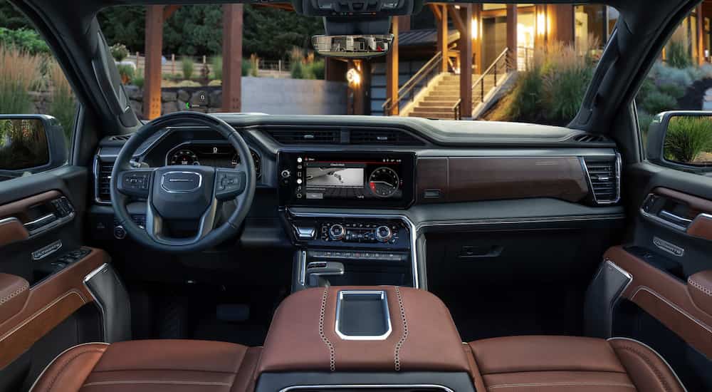 The brown interior of a 2024 GMC Sierra 1500 Denali Ultimate is shown.