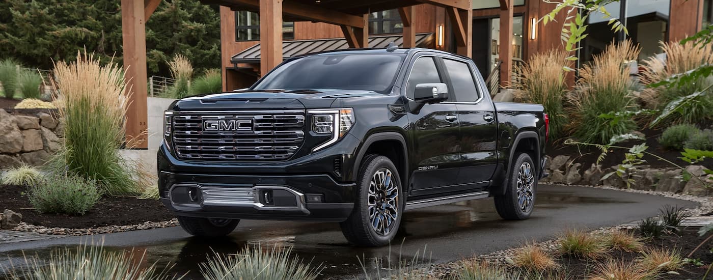 Black 2026 GMC Sierra 1500 parked on a driveway.