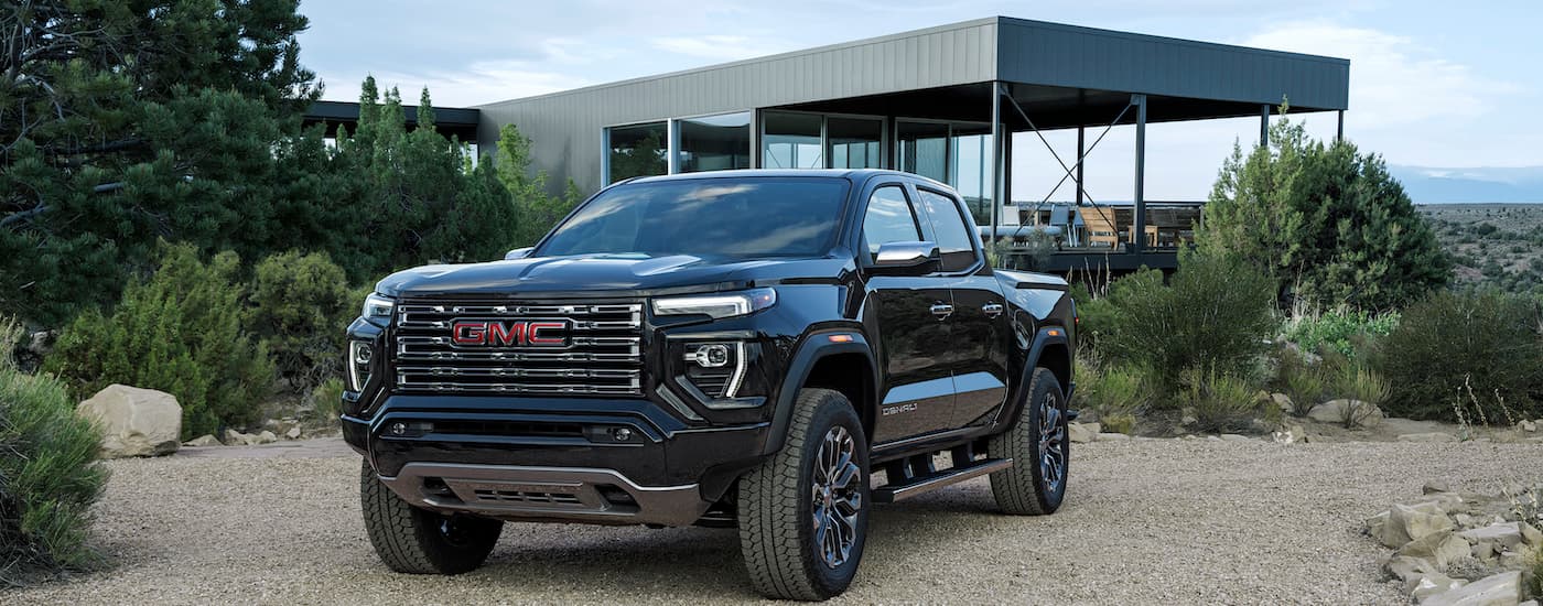 A black 2025 GMC Canyon Denali from the front at an angle.
